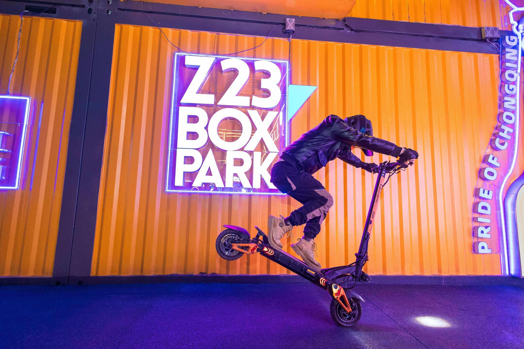 Rider performing a stunt on an e-scooter in vibrant urban setting, showcasing Top E-Scooters for Urban Commuters.
