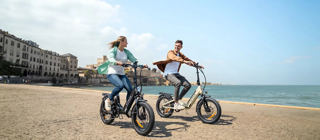 Two riders enjoying the ENGWE L20 3.0 Boost Electric Bike along a beachside path.