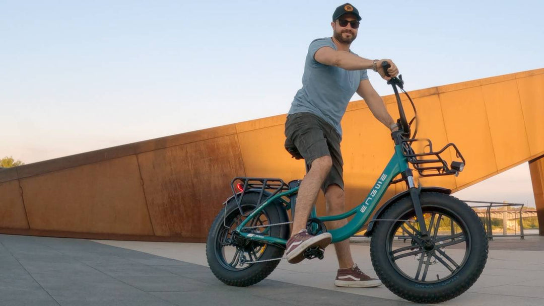Person riding the ENGWE L20 Boost Electric Bike in a scenic outdoor setting.