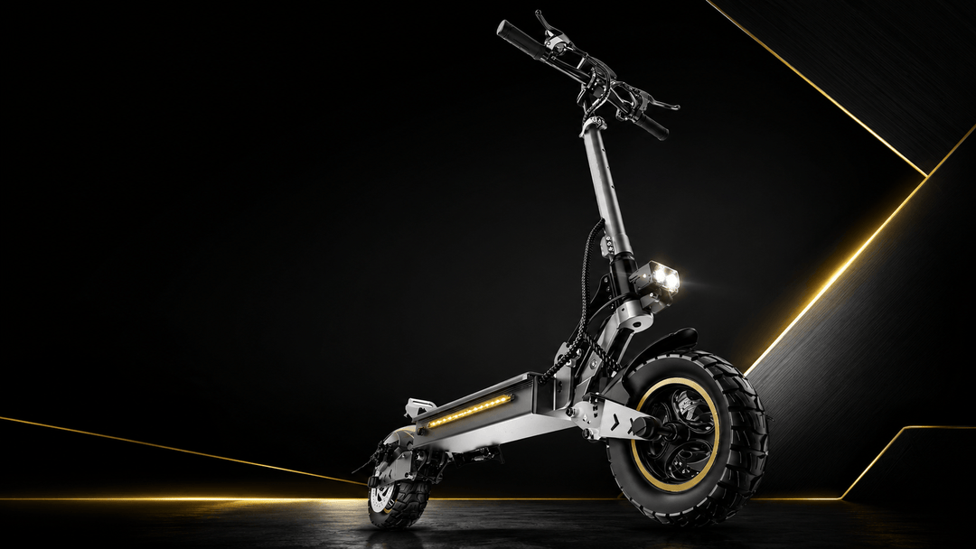 700W all-terrain electric scooter showcasing a sleek design with rugged tires and bright LED lights.
