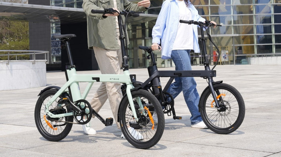 Two riders enjoying the ENGWE P20 Folding E-Bike Compact urban precision in a modern outdoor setting.