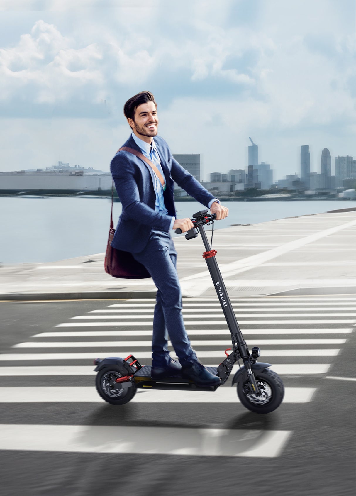 Man in a suit riding an electric scooter on a city street, smiling against a scenic urban backdrop.