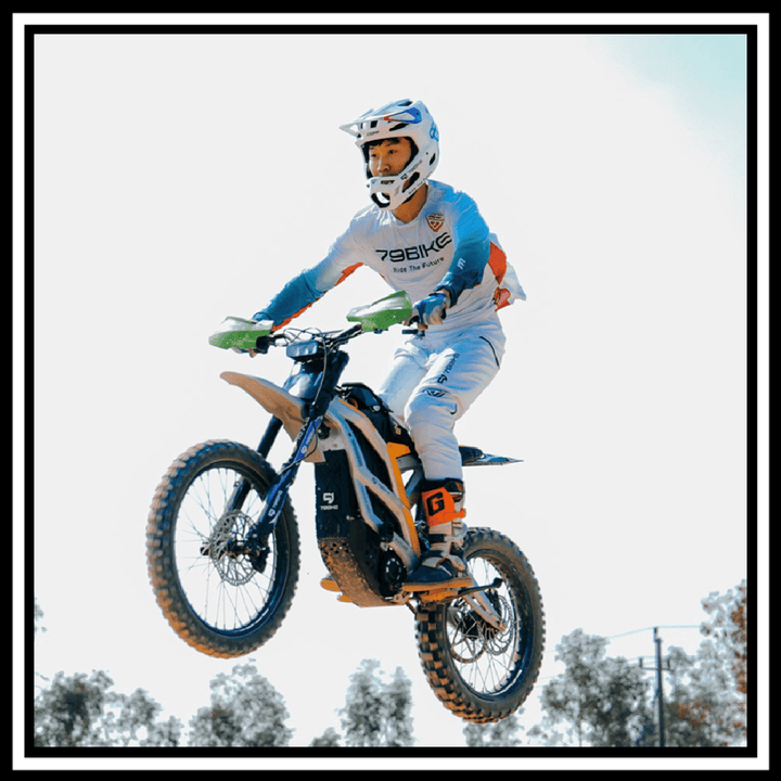 Rider performing a jump on the 🇮🇪🇪🇺🇬🇧🇺🇸 79BIKE-FALCON PRO 10000W OFF-ROAD electric dirt bike.