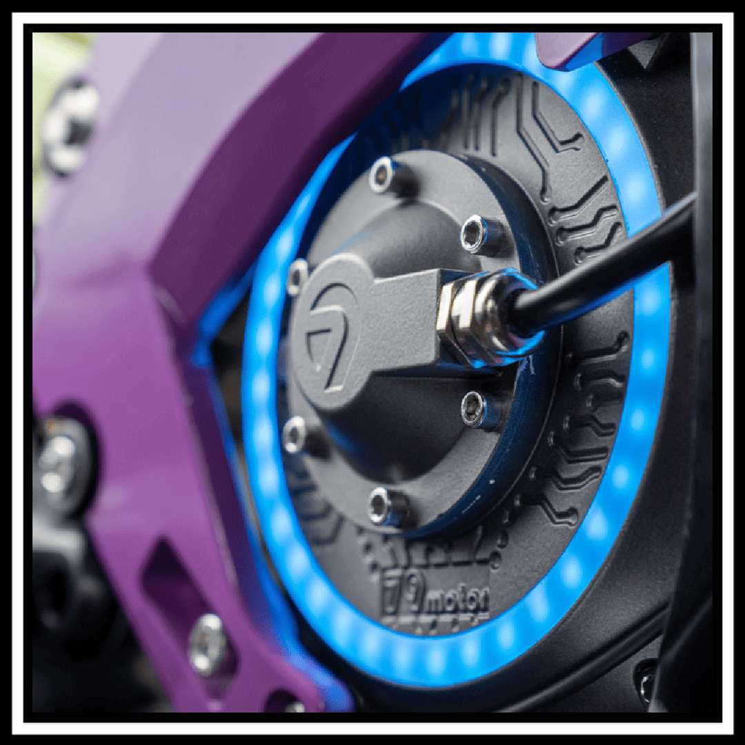 79BIKE-FALCON PRO OFF-ROAD ELECTRIC DIRT BIKE motor close-up with blue LED lighting and purple casing.