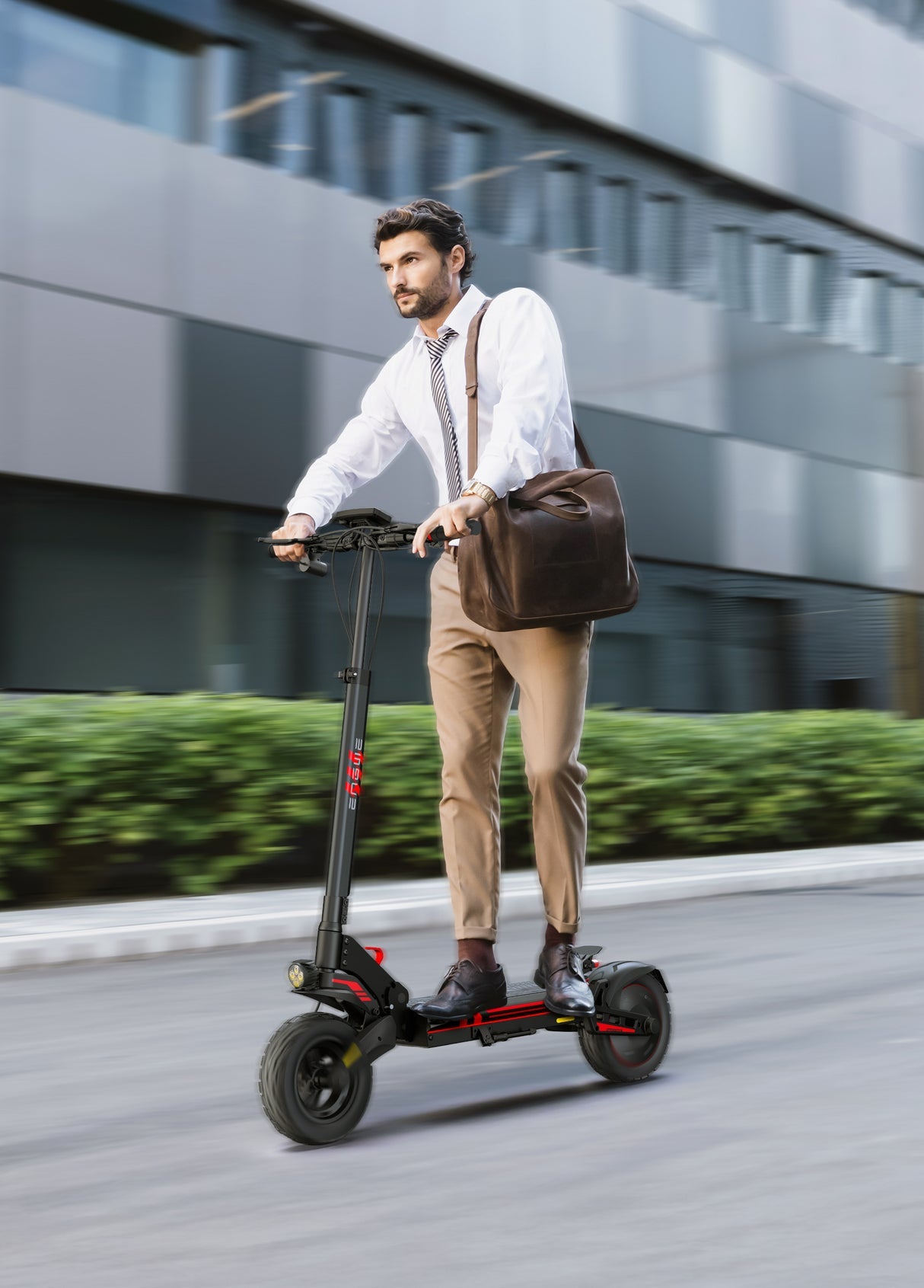 Professional man commuting on an electric scooter, wearing business attire and carrying a leather bag.