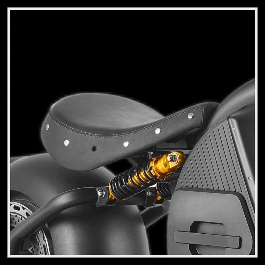 Close-up of EAHORA M8S electric motorcycle seat with suspension detail.