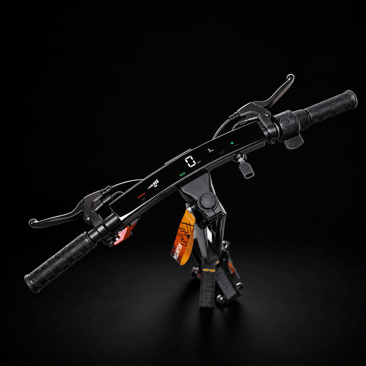 A black electric bicycle handlebar assembly with integrated grips, brake levers, a central control module, and a visible orange hanging tag, photographed on a dark studio background. Kukirin G4 Ultra Electric Scooter