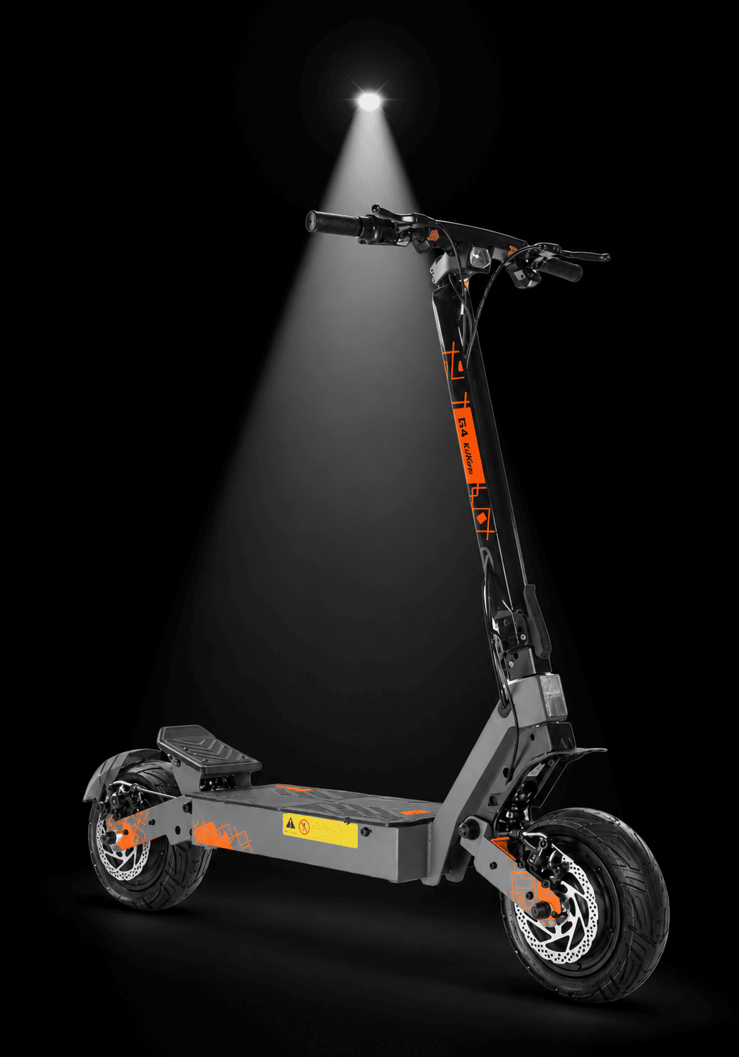 Kukirin G4 Ultra Electric Scooter - A foldable electric scooter with a dark gray frame and bright orange accents, shown on a black background with a spotlight effect shining down on it.