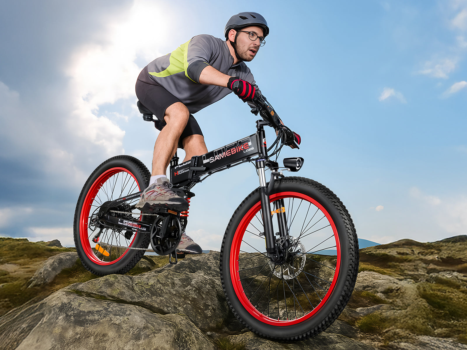 Man riding a mountain bike on rocky terrain, showcasing adventure and fitness in a vibrant outdoor setting.