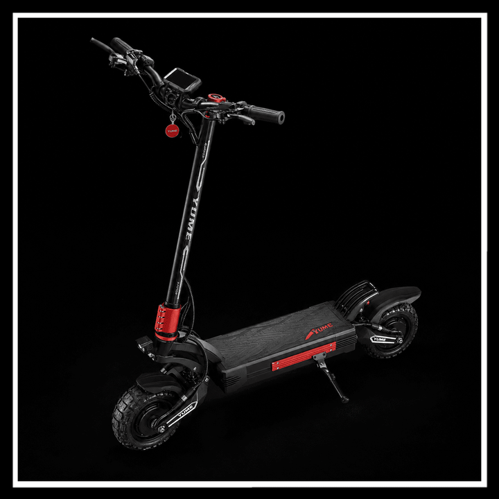 YUME Raptor 2 electric scooter with black and red design on a dark background.