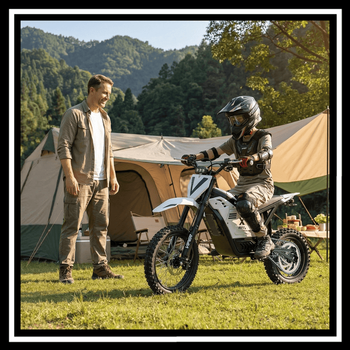 A man watches a child riding the VIPCOO H2 electric dirt bike near a camping tent.