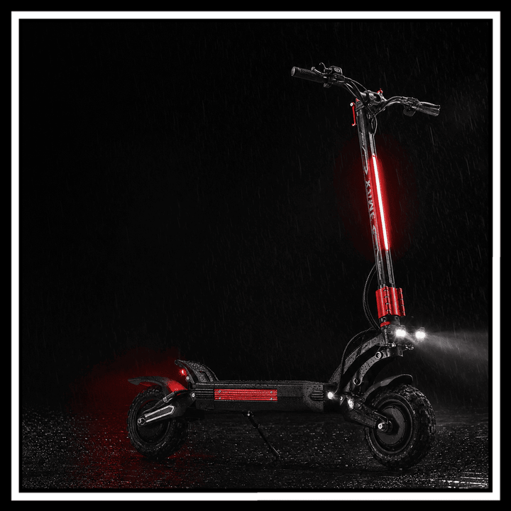 YUME Raptor 2 electric scooter illuminated in the rain with vibrant red lights against a dark background.