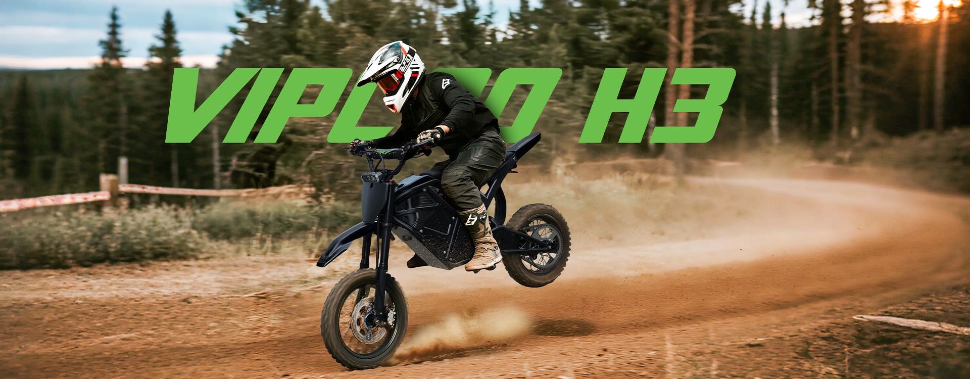 Rider in protective gear performing a jump on a VIPER H3 electric dirt bike on a forest trail.