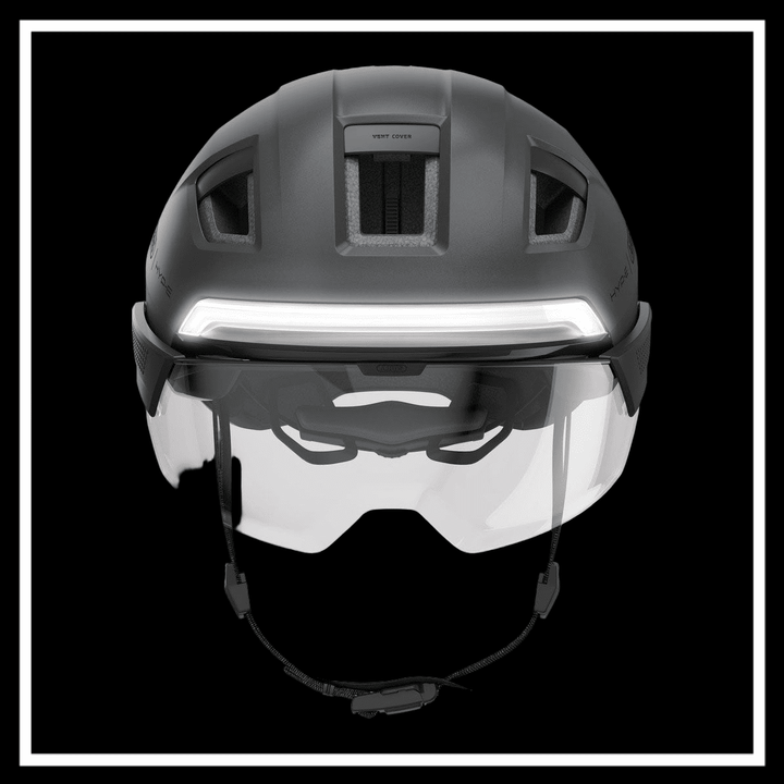 ABUS HYP-E ACE BICYCLE HELMET shown from the top with visor and integrated lights for urban commuting.