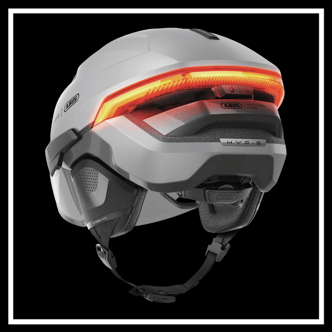 ABUS HYP-E ACE BICYCLE HELMET showcasing the lighting features and design for urban commuting.