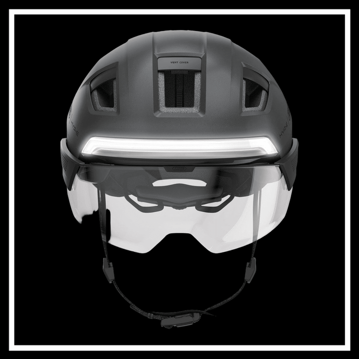 ABUS HYP-E ACE BICYCLE HELMET ELECTRIC BIKE in black with visor, top view on a dark background.