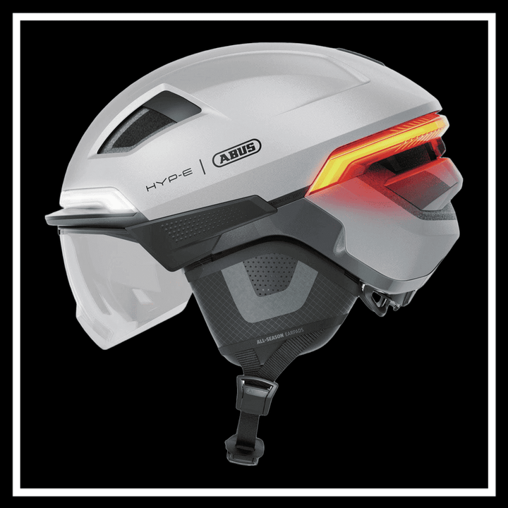 ABUS HYP-E ACE BICYCLE HELMET with rear lights and visor for urban commuting safety.