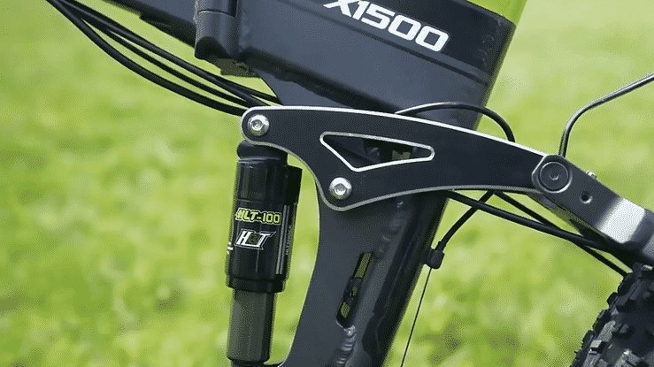 Close-up of the suspension system on the Bezior X1500 electric bike showcasing its advanced design and components.