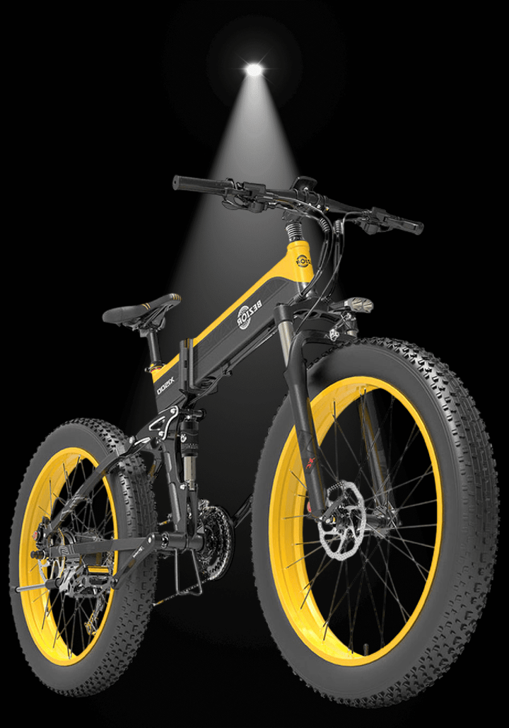 🇮🇪🇪🇺 BEZIOR X 1500W electric mountain bike with yellow wheels and dual suspension under spotlight.