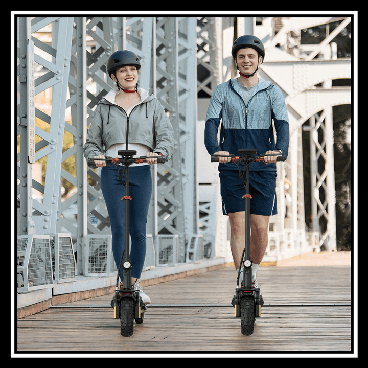 Two people riding electric scooters on a bridge, showcasing the performance of the 🇮🇪🇪🇺🇬🇧🇺🇸 iENYRID M4 PRO S+.