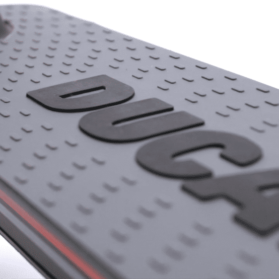 Close-up of the deck of the 🇮🇪 DUCATI PRO II EVO electric scooter showcasing the textured surface and branding.