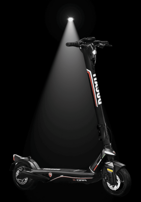DUCATI PRO III electric scooter showcasing its sleek design under spotlight with black background.