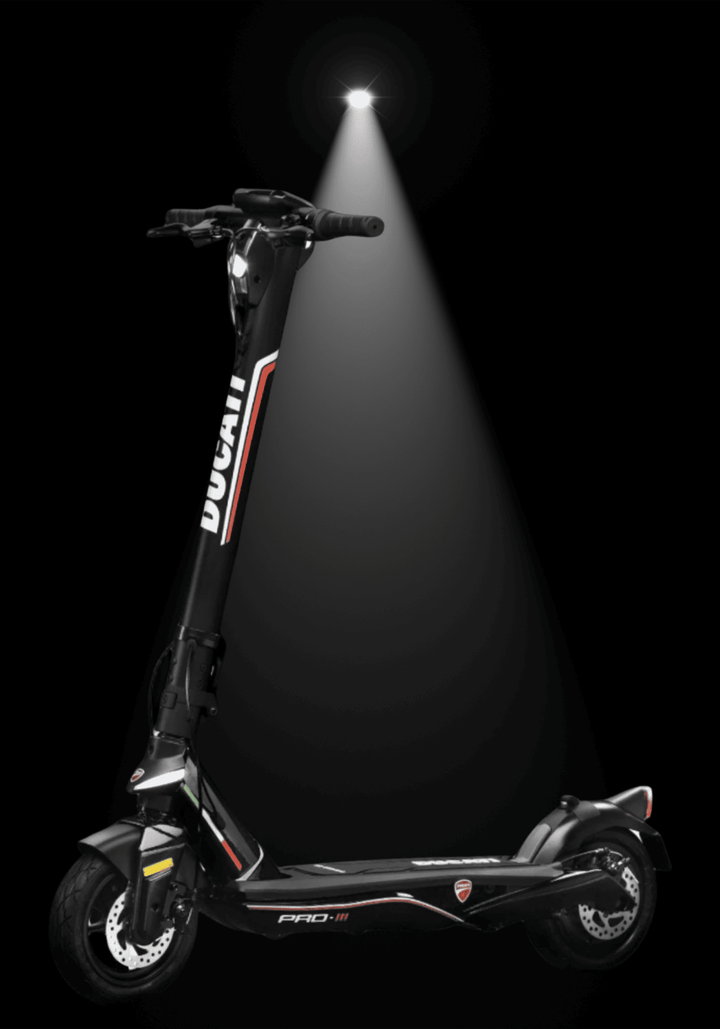 DUCATI PRO III electric scooter showcasing its sleek design under spotlight with black background.