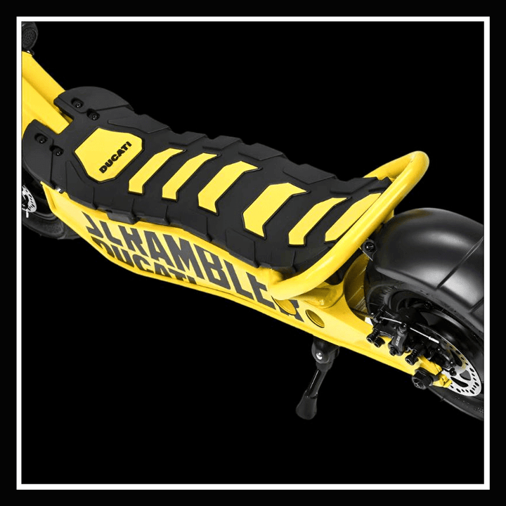 Close-up of the DUCATI SCRAMBLER E-Cross scooter's yellow seat and specific design features.