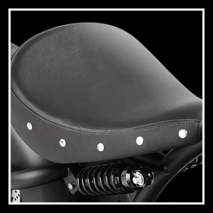 EAHORA KNIGHT M1PS electric chopper motorcycle seat with rivets and suspension detail.
