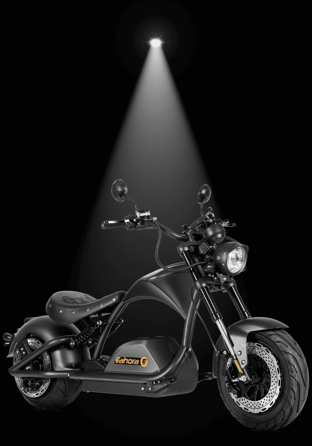 INTHEZONE M1PS electric motorcycle in spotlight against black background, showcasing Harley-Style electric chopper design.
