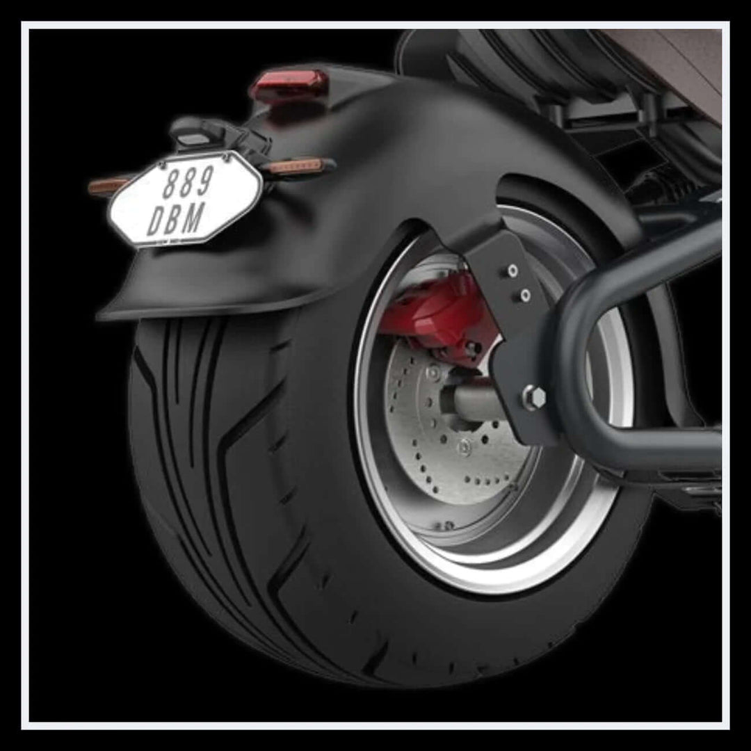 Close-up of the rear tire of the EAHORA M8S electric motorcycle showcasing the design and manufacturer details.