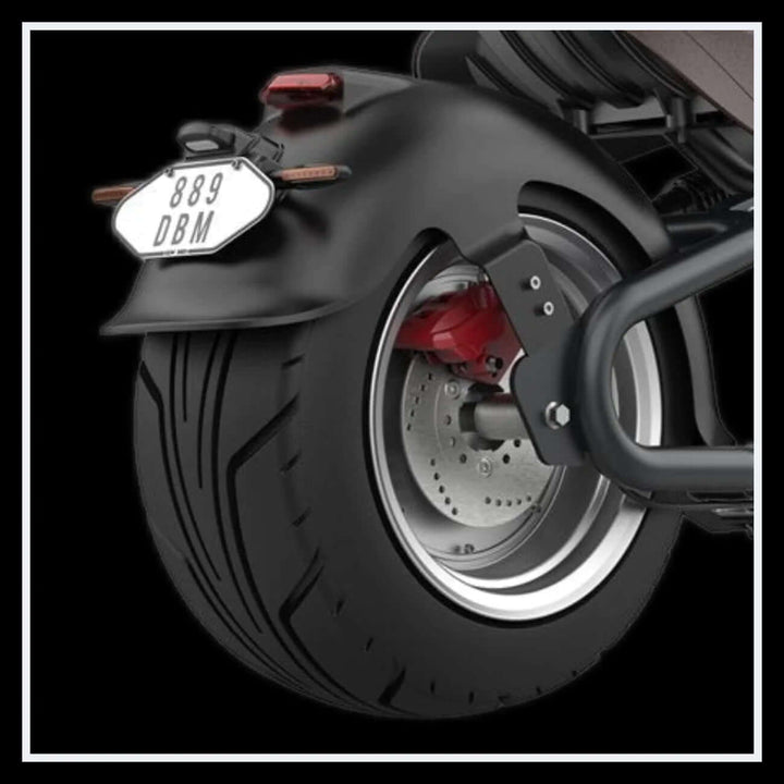 Close-up of the rear tire of the EAHORA M8S electric motorcycle showcasing the design and manufacturer details.