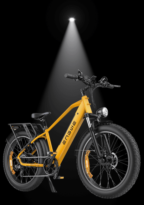 ENGWE E26 electric bike in bright yellow color with fat tires and all-terrain features, illuminated by spotlight.