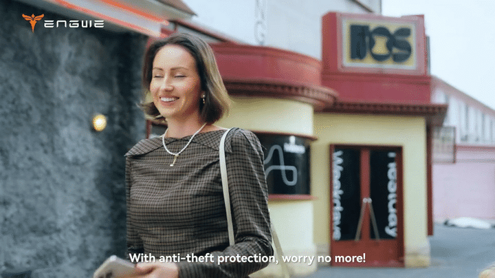Woman smiling near a building, promoting the ENGWE L20 3.0 PRO with anti-theft protection.