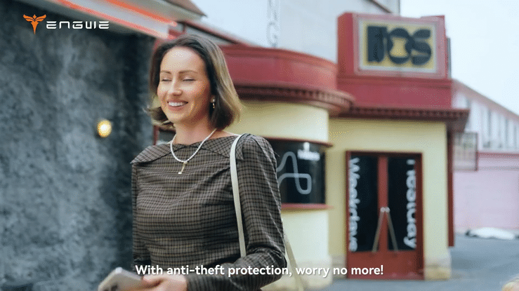 Woman smiling outdoors next to ENGWE logo, promoting the benefits of the ENGWE L20 3.0 PRO ELECTRIC BIKE with anti-theft protection.