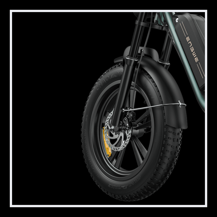 Engwe M20 electric bike front wheel and fat tire, showcasing its robust build and design for enhanced performance.