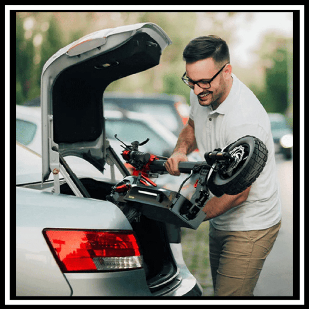 Man loading the 🇮🇪🇬🇧🇪🇺 ENGWE Y600 S electric scooter into a car trunk.
