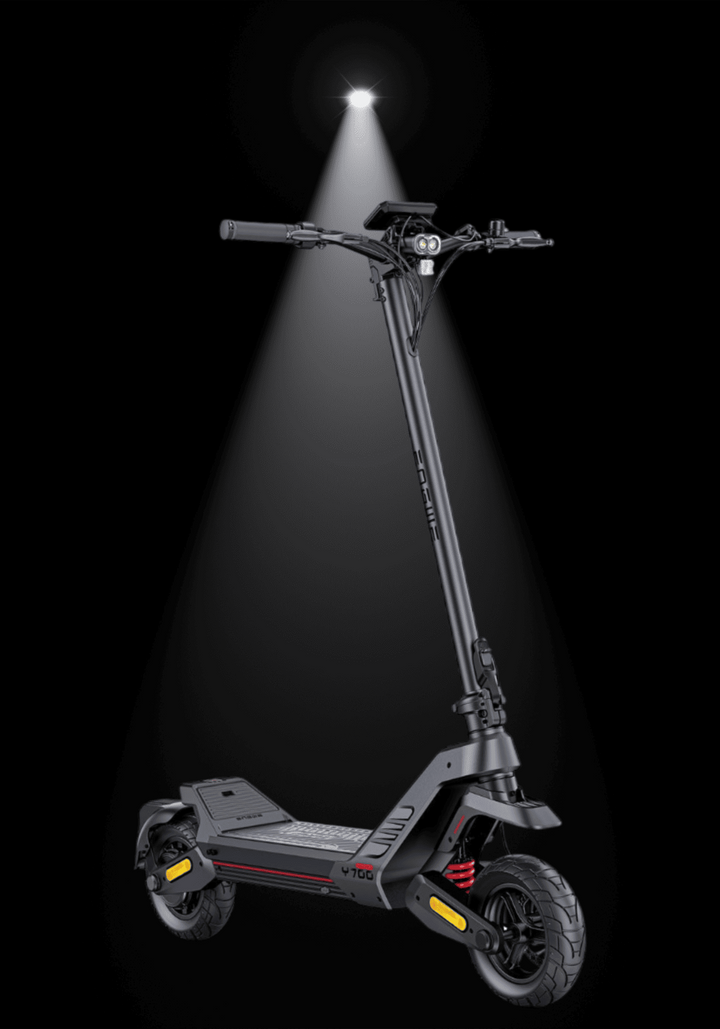 ENGWE Y700 Electric Scooter illuminated against a dark background, showcasing its sleek design and features.