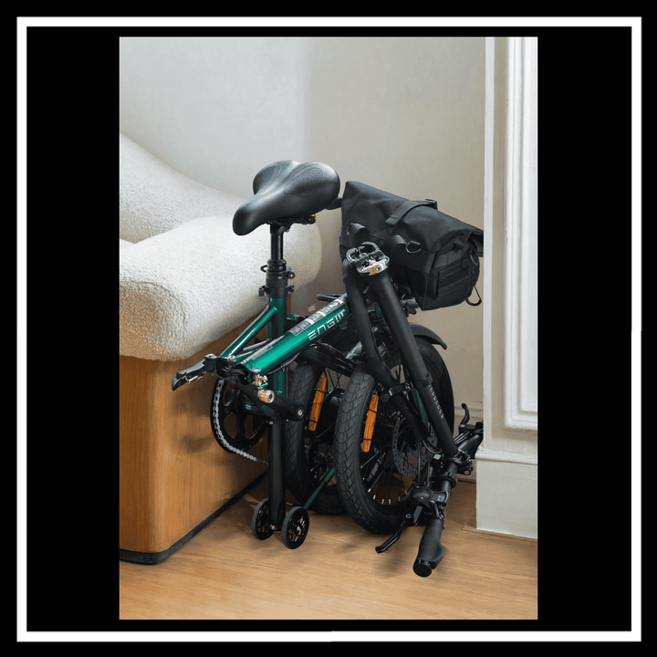 ENGWE ZIP ELECTRIC BIKE folded and stored next to a sofa, showcasing its lightweight and compact design.