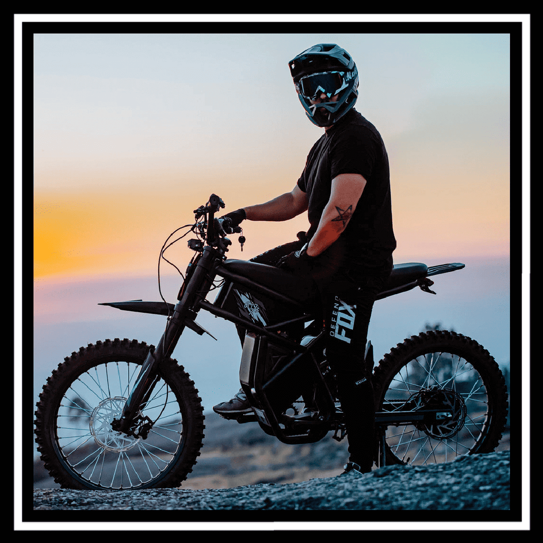 GT73PRO 3000W RIDING' TIMES DIRT E-BIKE rider in action at sunset, showcasing top performance and style.