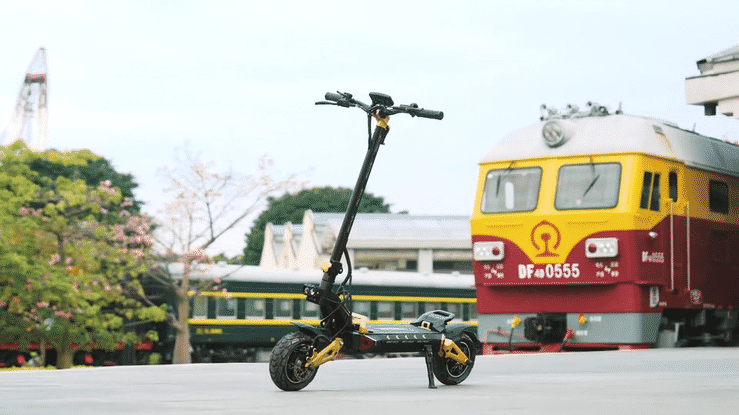 iENYRID ES60 electric scooter showcased in front of a train station, highlighting its sleek design and powerful features.