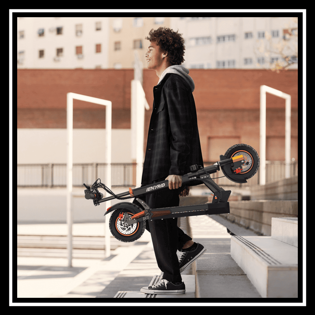 Young person carrying the iENYRID M4 PRO S+ electric scooter up the stairs.