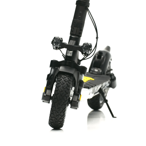 Close-up view of the front of the JEEP 2xe electric scooter showcasing its wheels and headlamps.