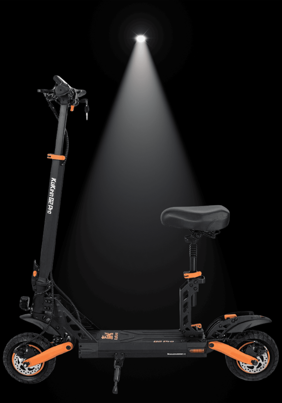 KUKIRIN G2 Pro electric scooter illuminated with spotlight against a dark background.
