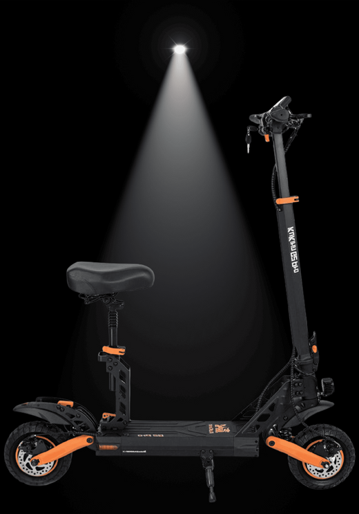 KUKIRIN G2 Pro electric scooter illuminated with spotlight against a dark background.