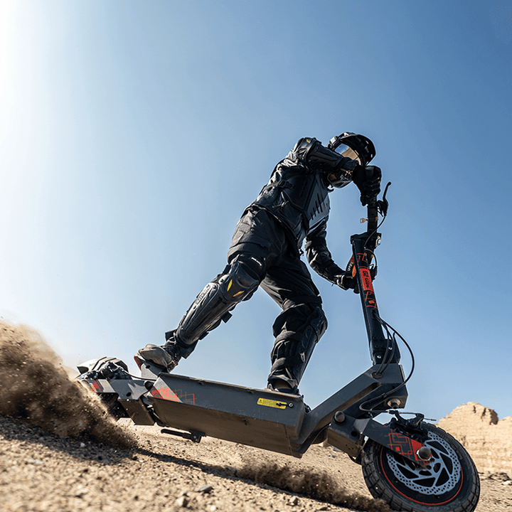 Rider on the 🇮🇪🇪🇺 KUKIRIN G2 ULTRA electric scooter kicking up dust in an off-road environment.