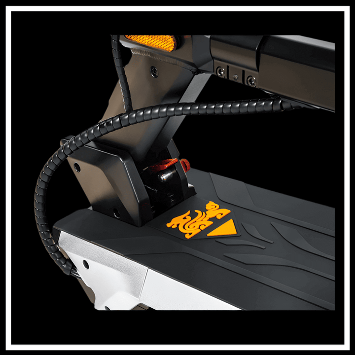 KUKIRIN M4 MAX ELECTRIC SCOOTER close-up of deck with orange design and wires showing.