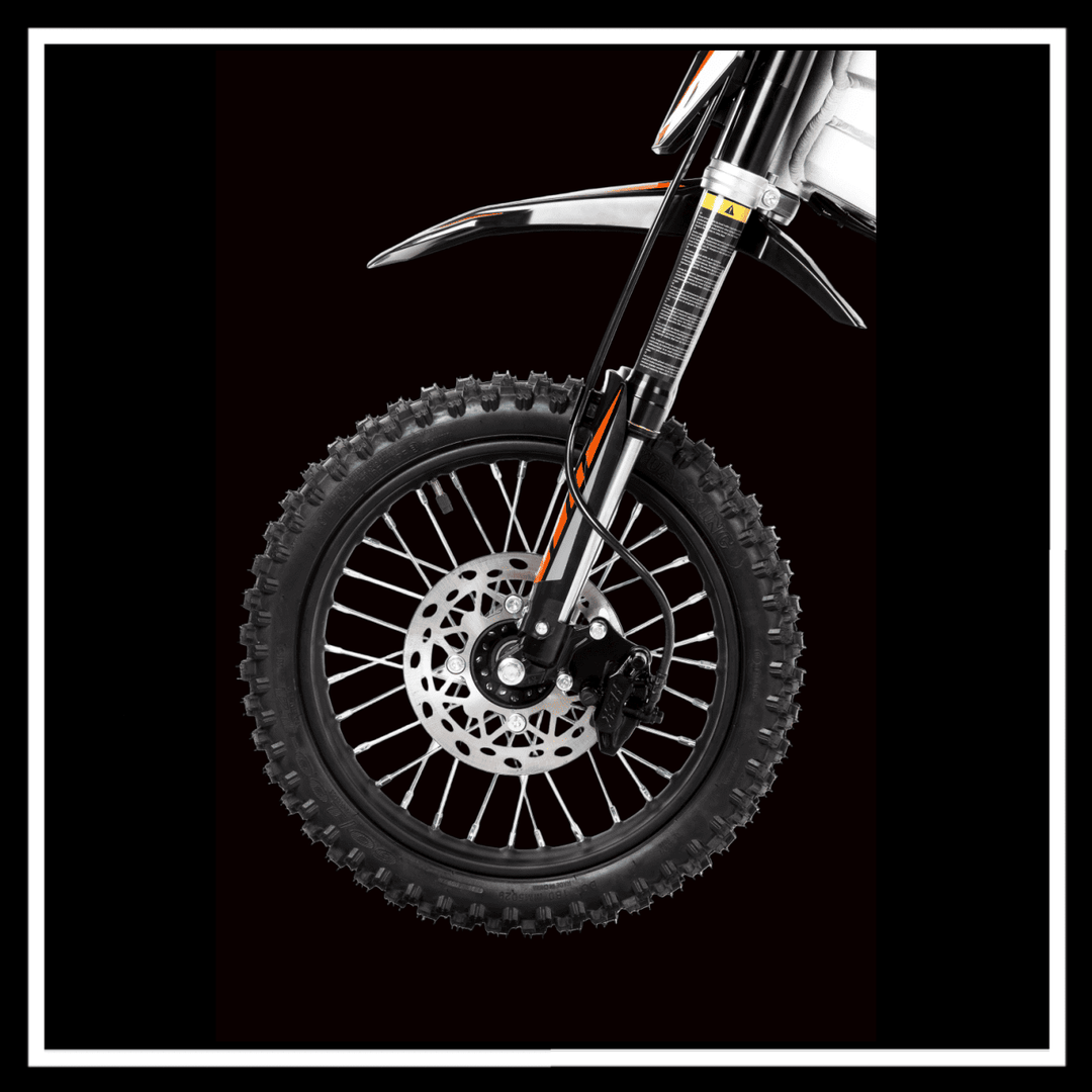 Front wheel of the KUKIRIN X1 ELECTRIC DIRT BIKE showcasing off-road tire and disc brake.