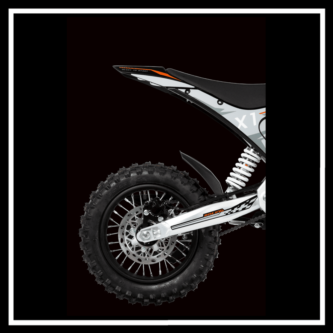 View of the rear wheel and suspension of the KUKIRIN X1 ELECTRIC DIRT BIKE showcasing its rugged design.