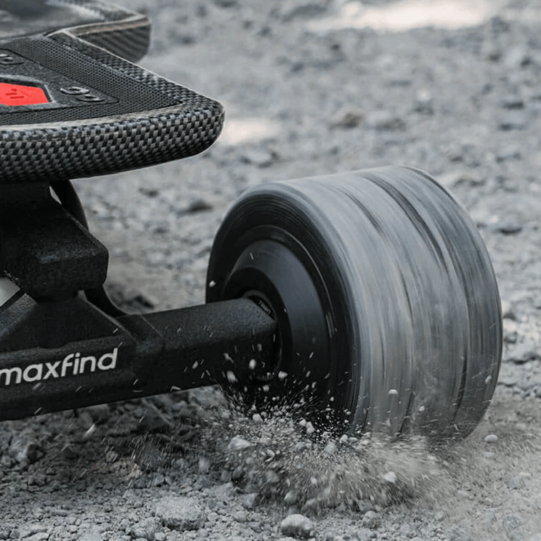 Maxfind FF Pro electric skateboard wheel on rough terrain, showcasing dual motors and shock-absorbing capabilities.